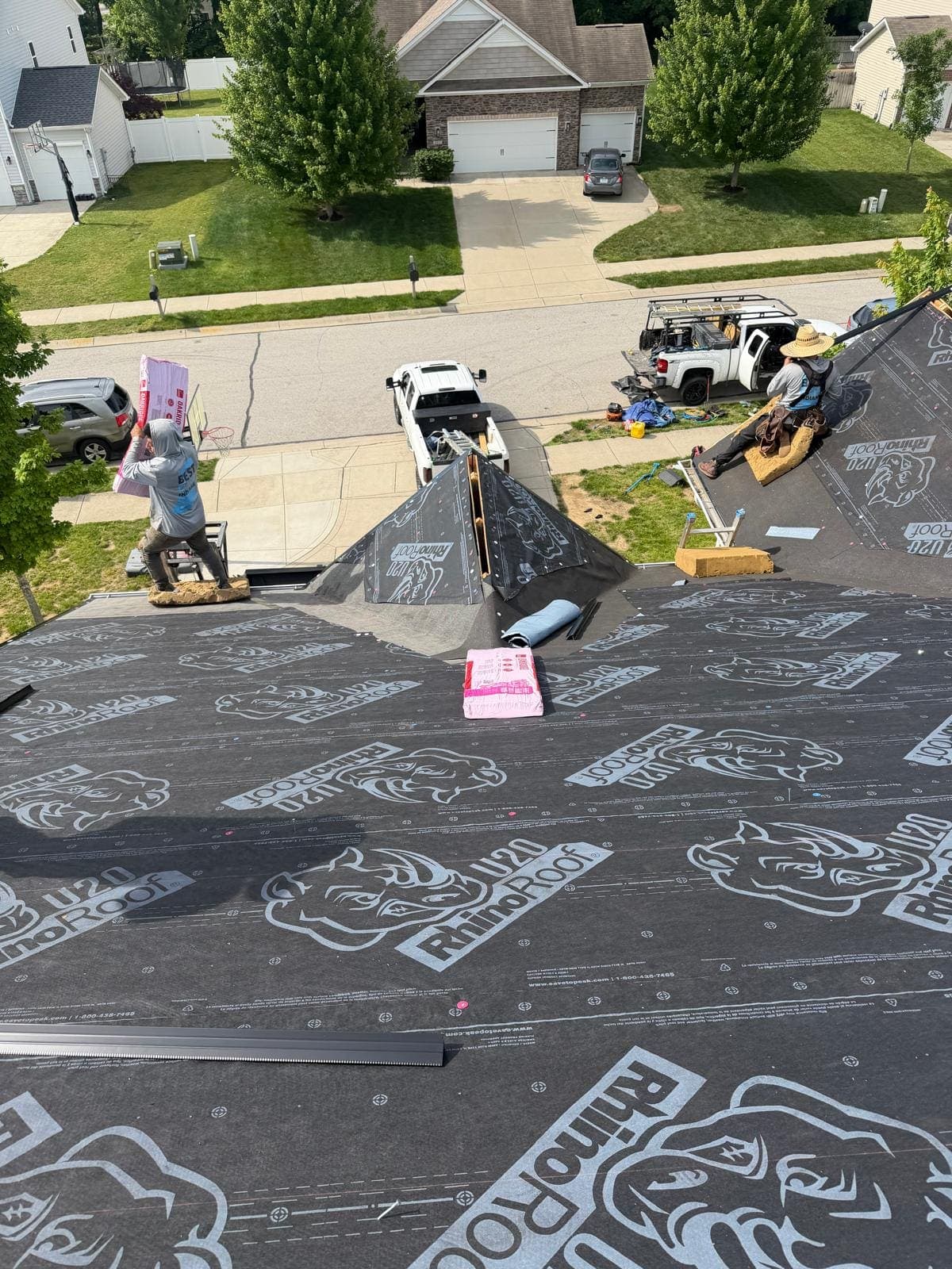 Checkered Flag Roofing crew tearing off and dried-in on a roof replacement in Avon, Indiana